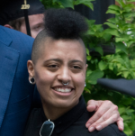 Chiara de Blasio (European father & African American mother). De Blasio resembles most biracial individuals born to a European parent and an African American/Afro-Caribbean parent in that her physiognomy is intermediate between the two, though favoring her European side overall (except for hair texture). This is due to the extra European admixture that is already present in her African American parent