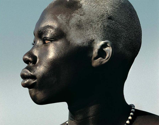A Nilotic Dinka man, retaining the characteristic facial prognathism of his Nilo-Saharan/Niger-Congo ("Negro") ancestors.