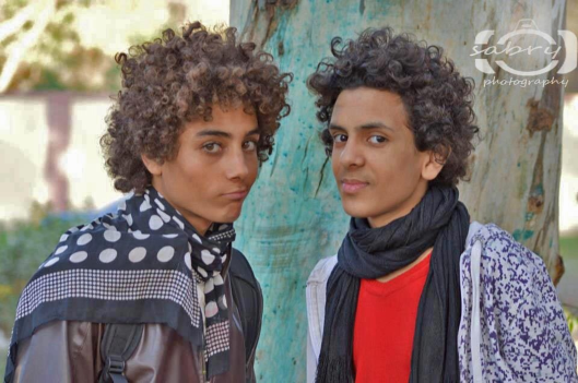 Egyptian men, retaining the soft-textured curly hair of their Ptolemaic-era Egyptian ancestors.