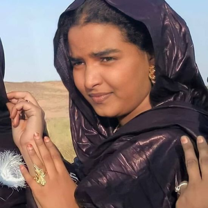 A Sudanese "Arab" woman. Genetic analysis suggests that the Toubou and the Baggara/Shuwa "Arabs" are a westward extension of the same, originally Afro-Asiatic-speaking ancestral stock as Sudanese "Arabs." All of these populations trace their proximal or recent ancestry to the medieval peoples buried at Kulubnarti, Sudan, which indicates common origins.